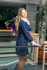 beautiful young woman with a shopping bags in the mall