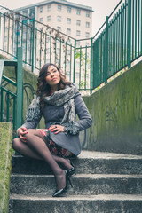 Beautiful girl posing in an urban context
