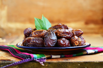 Dried dates on oriental ceramic plate