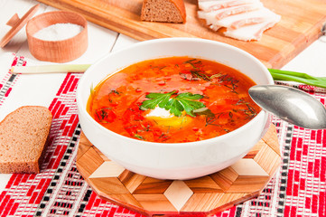Ukrainian national red borscht with sour cream closeup