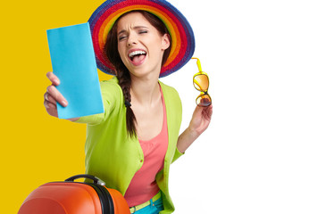 Woman tourist with travel suitcase and blue boarding pass, 