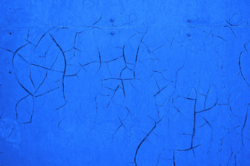 Blue cracked wall as an abstract background