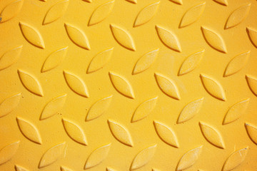 Yellow metal diamond plate pattern background.
