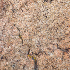 Natural granite stone texture background. Rough and rusty. Close