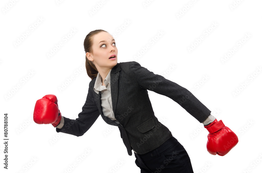 Wall mural businesswoman with boxing gloves isolated on white