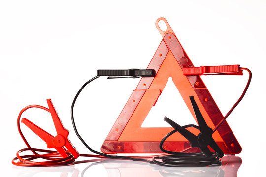 warning triangle and jump start cable