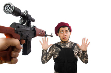 Soldier with a weapon isolated on white