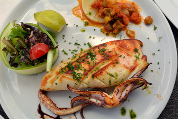 The grilled squid dish is of the Mediterranean cuisine