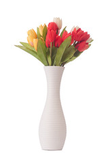Vase with colourful tulips on white