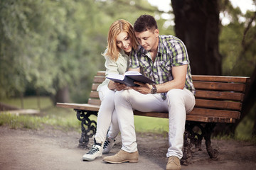 Relationship and education concept. Young happy couple of studen