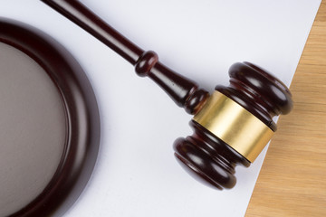 judge hammer on white paper and table