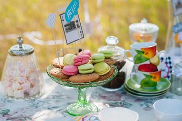 Colorful party table with donuts and candy