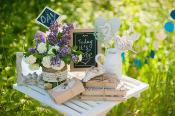 Picnic white table with beautiful bouquet