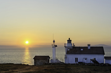 Fototapeta premium Sonnenaufgang beim Leuchtturm