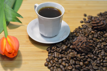 black coffee, truffel sweets on coffee beans