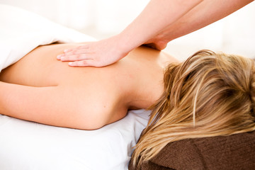Obraz na płótnie Canvas Massage: Woman Gets Back Massage
