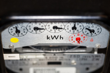 kWh electric home meter and dials. Concept for price rise, energy supplier and meter reading. - obrazy, fototapety, plakaty