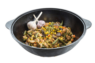 Vegetables barbecue in a cauldron