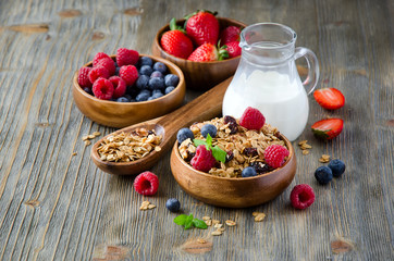 Fresh healthy breakfast with granola and berries, wooden backgro - 80804130