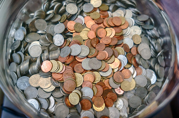 Thai coins in glass bucket © brize99