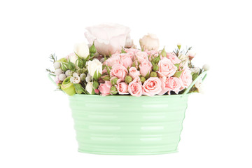 bouquet of bright red roses in a bucket on a white background
