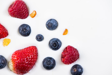 fresh berries fruits isolated on greek yogurt, healthy backgroun
