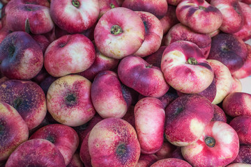 Fresh saturn peaches fruit background