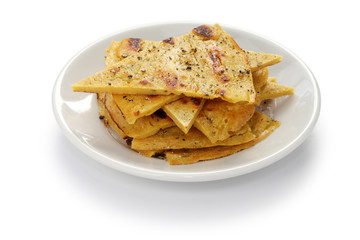 socca, farinata, chickpea pancake isolated on white background