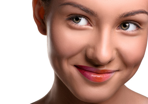 Close up head shot of young woman looking at the side