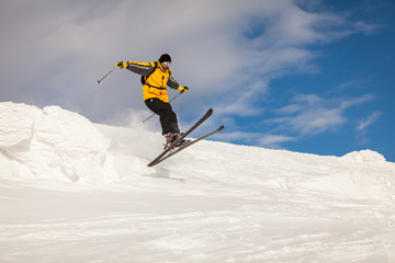 Naklejka na ściany i meble Man Snow Skiing Against Blue Sky