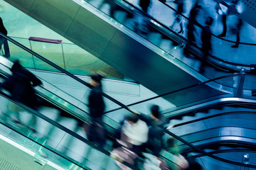 People on crossing Escalators - Powered by Adobe