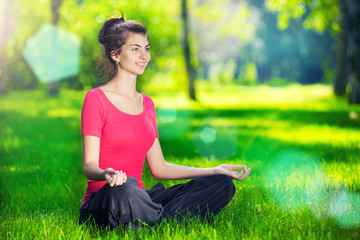 Young woman doing yoga exercises