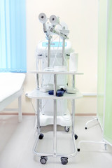 The image of an empty treatment room. Magnetic therapy device