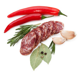 Sliced sausage spices isolated on white background