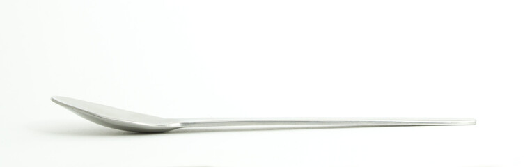 Metal and wood spoon in profile