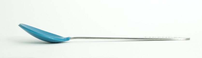 Metal and wood spoon in profile