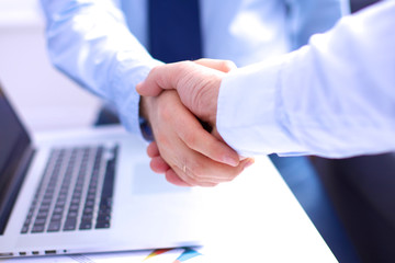 Business people shaking hands, finishing up a meeting