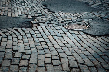 Gordijnen Rough old cobblestone street in New York City © littleny
