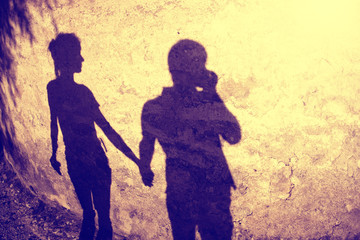Vintage silhouette of two people holding hands