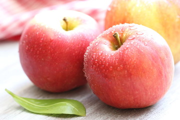 Fresh apples with drops of water