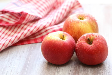 Fresh apples with drops of water