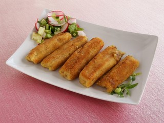 coated in bread and eggs croquettes with cheese, mushrooms