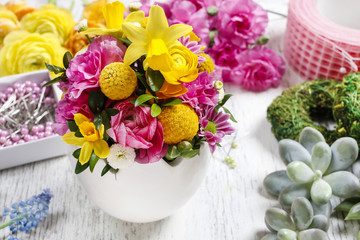 Fototapeta na wymiar Easter floral arrangement in white egg shell