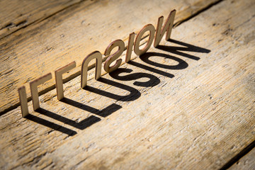 Wooden letters build the word illusion