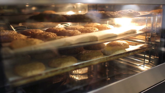 Fresh oatmeal cookies are prepared on a metal grid