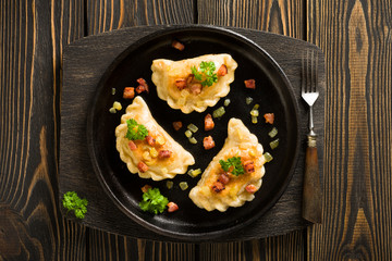 Fried dumplings with onion and bacon top view - 80820597