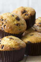 Orange and Chocolate Muffins Stacked up on a Table