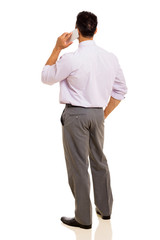 rear view of man talking on cell phone