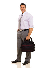 middle aged businessman holding briefcase