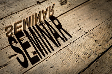 Wooden letters build the word seminar